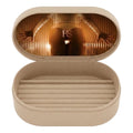 An open oval eyeglasses case in a warm beige fabric, featuring a printed design on the inside lid of a figure in a red and gold corset with outstretched arms under a curtain, with a small 'KS' monogram at the top.