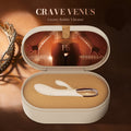 An open round presentation box containing a white rabbit-shaped vibrator with a clear cap, set against a warm brown background with text reading 'CRAVE VENUS' and a 'Made in Japan' badge.