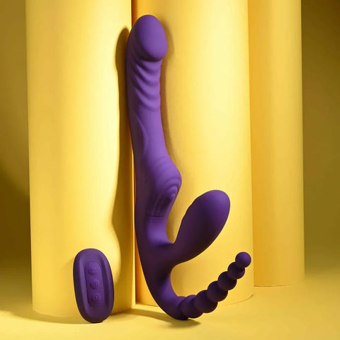 Purple silicone toy against a yellow curtain background