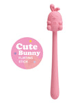 Pink 'Cute Bunny' flirting stick with a label on a white background