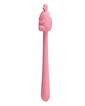 Pink silicone tool with a handle on a white background