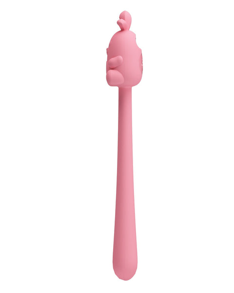 Pink silicone tool with a handle on a white background