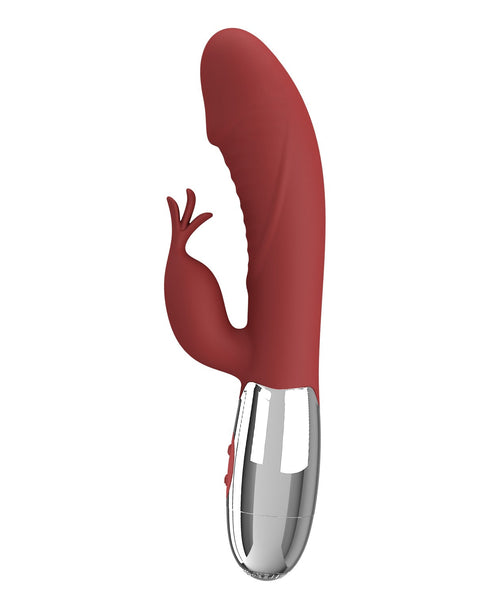 Red silicone product with a metallic base on a white background