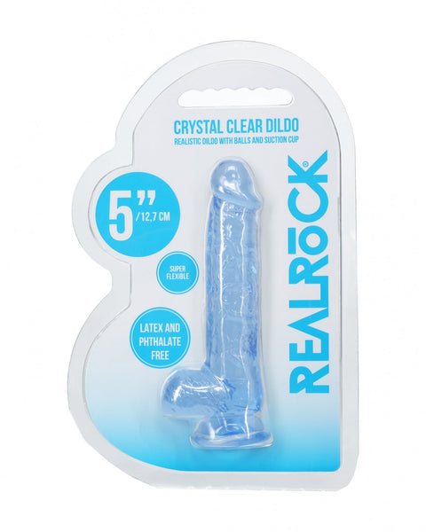 Crystal clear dildo in packaging with 'Real Rock' branding on a white background