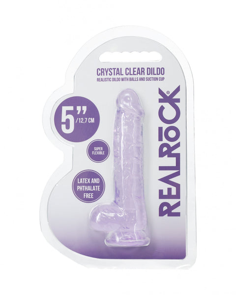 Clear dildo in packaging with 'Real Rock' branding on a white background