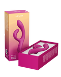 A pink and orange gradient retail box for the Wavoid Monstera Pleasure vibrator, with the box standing upright next to an open box displaying the pink curved vibrator inside.