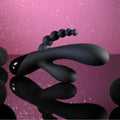 Black liquid-like object on a pink gradient background