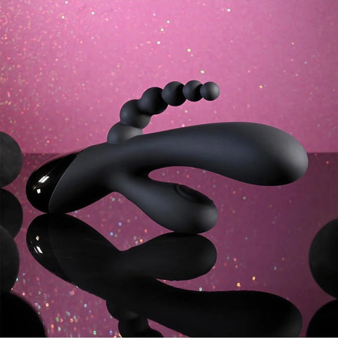 Black liquid-like object on a pink gradient background