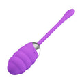Purple silicone tool with a long handle on a white background