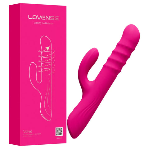 A bright pink personal massager shown next to its matching pink retail box on a plain white background. The box displays the brand name LOVENSE and the model name Velvo.