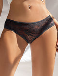 Black lace underwear worn by a person on a neutral background