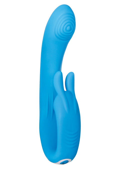 A bright blue silicone personal massager with a curved shaft, textured head, and integrated bunny ears on the handle, shown against a plain white background.