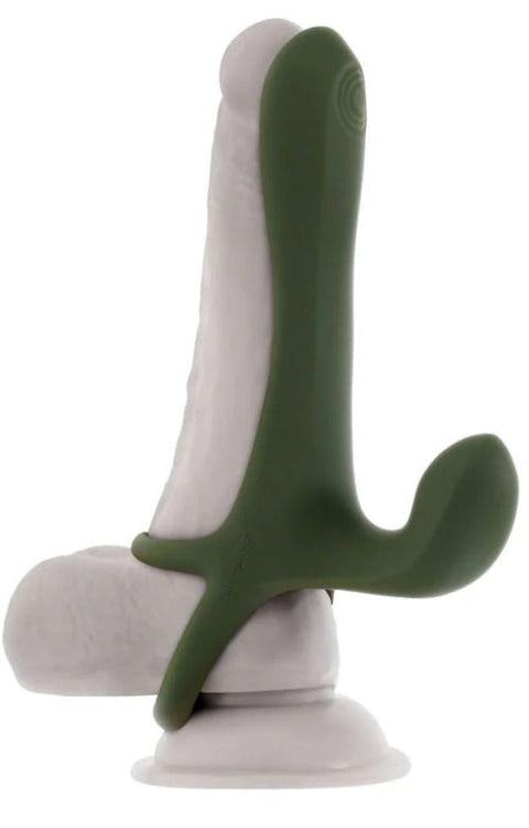Green and white silicone device with packaging labeled 'Zero Tolerance' on a white background