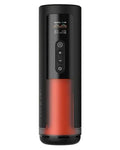 A portable cylindrical coffee maker with a black top section, a red lower body, and a digital display screen on the front, shown against a light gray background.